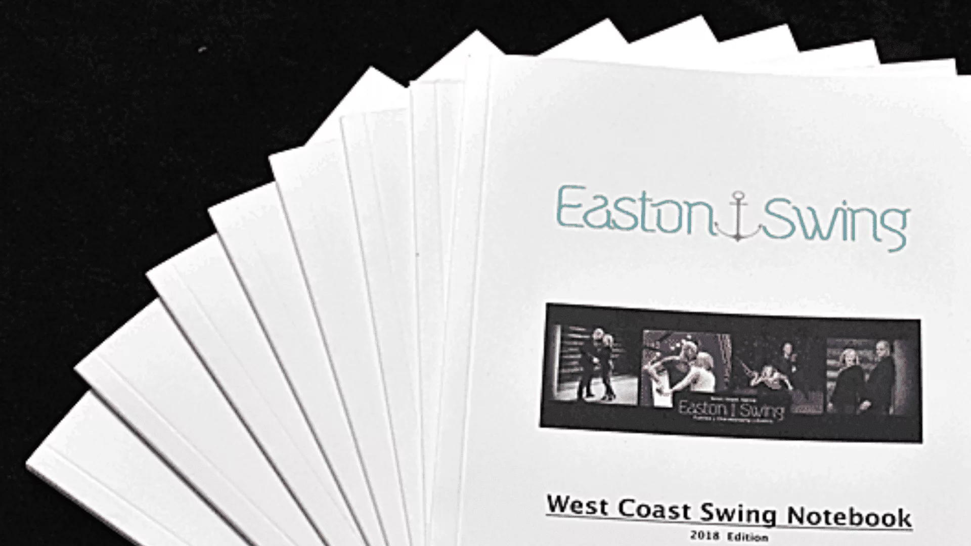 West Coast Swing notebook for Levels 1-3 photographed on a black background