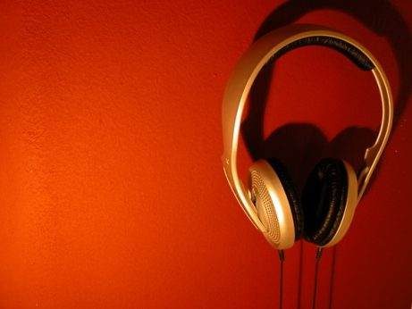 west coast swing music, Red Background with Gold over ear headphones